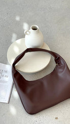 Brown Faux Leather Hobo Bag with Silver Zip Closure and Internal Pocket – Stylish Shoulder Handbag for Everyday Use 4